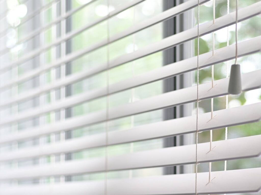 how to childproof blinds, close-up of a window blinds with a cord tassle