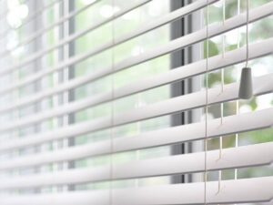 how to childproof blinds, close-up of a window blinds with a cord tassle